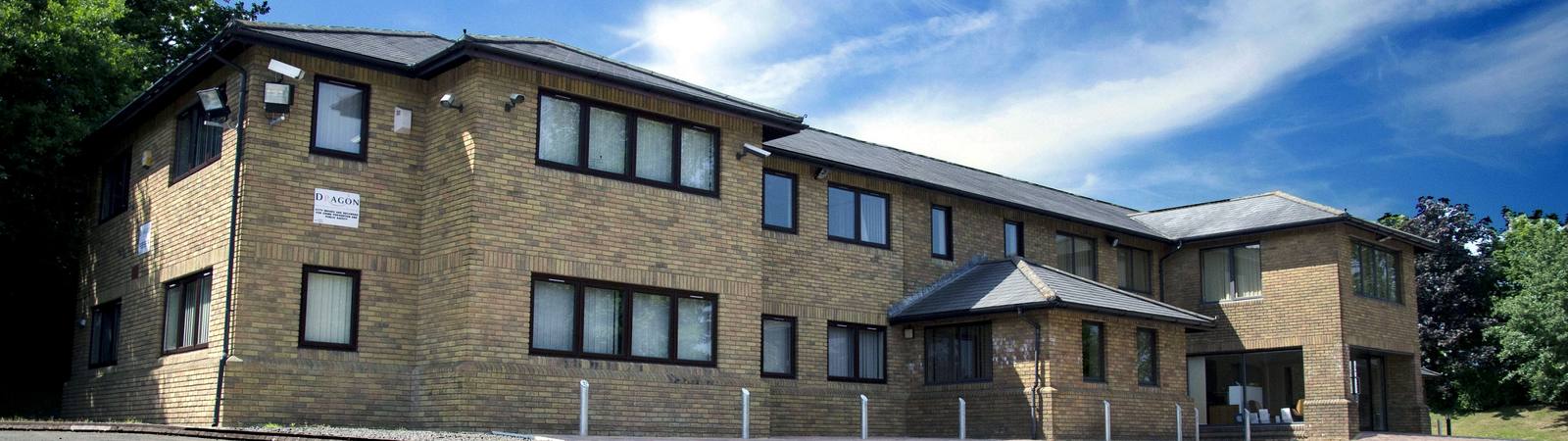 The full width of Pembroke House seen from the car park